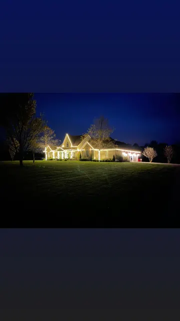 Wide holiday display viewed across the front lawn