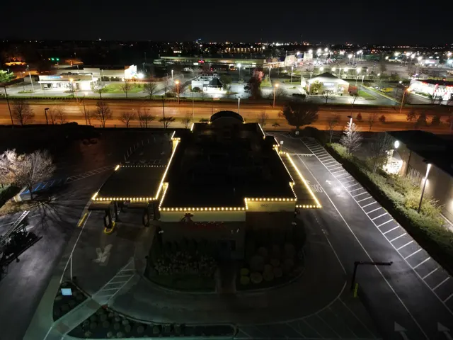 Holiday roofline lighting viewed from above a commercial property