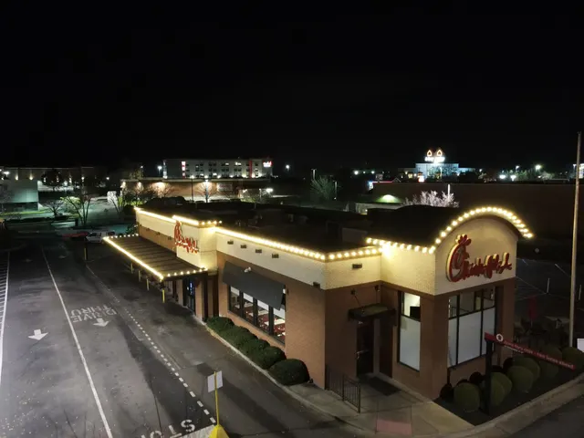 Holiday lighting following a commercial roofline and covered entry