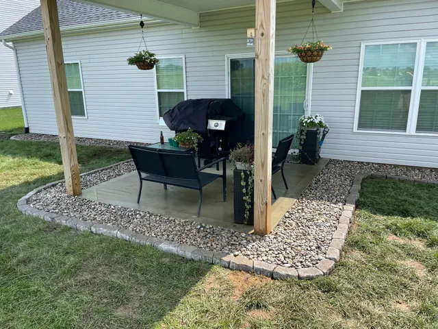 Gravel border and outdoor seating beneath a covered patio