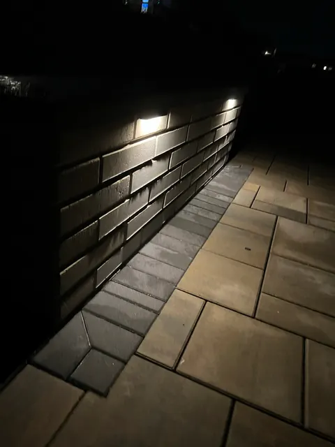 Close view of recessed lights in a block patio wall