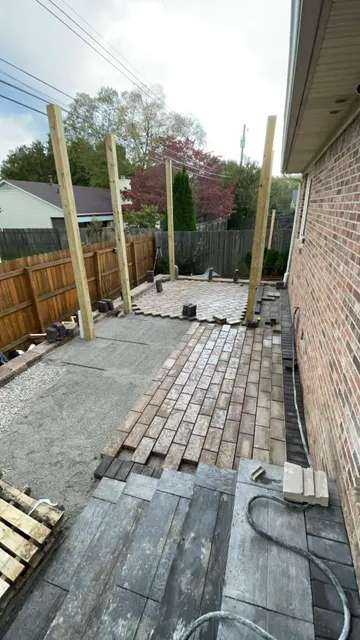 Paver installation beside a brick home
