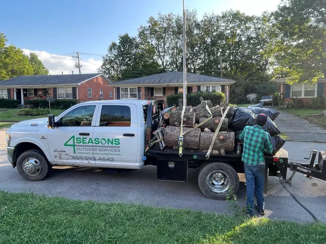 4 Seasons work truck carrying materials at a job site
